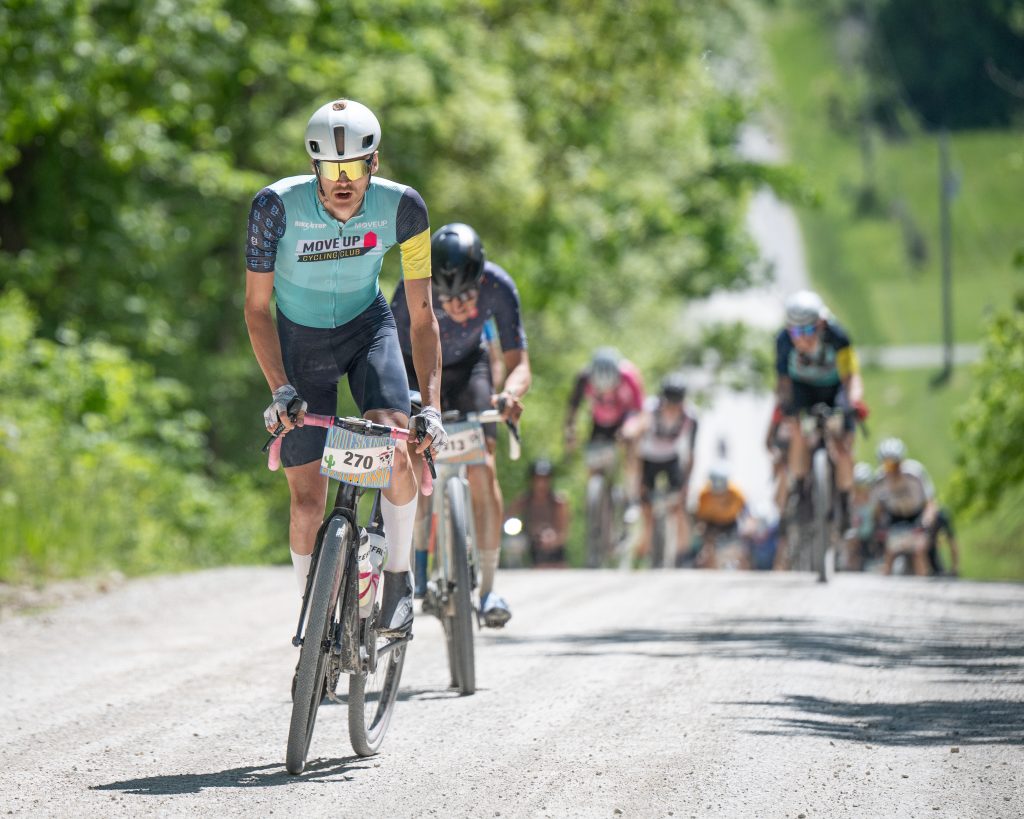Move Up Cycling Club rider leading a race group uphill