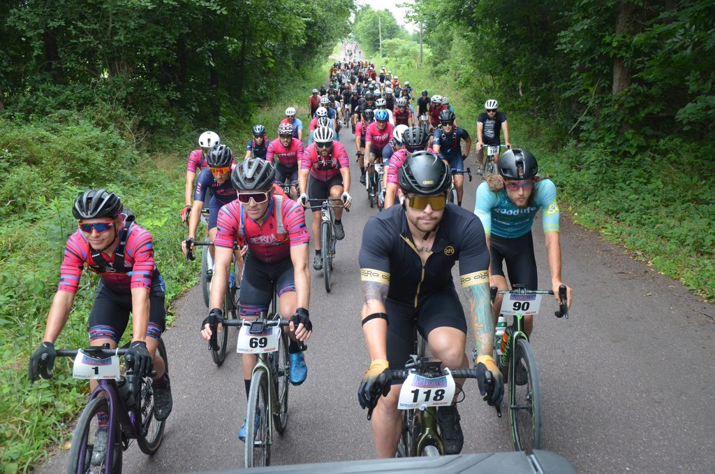 Large gravel race field with Move Up riders positioned near the front